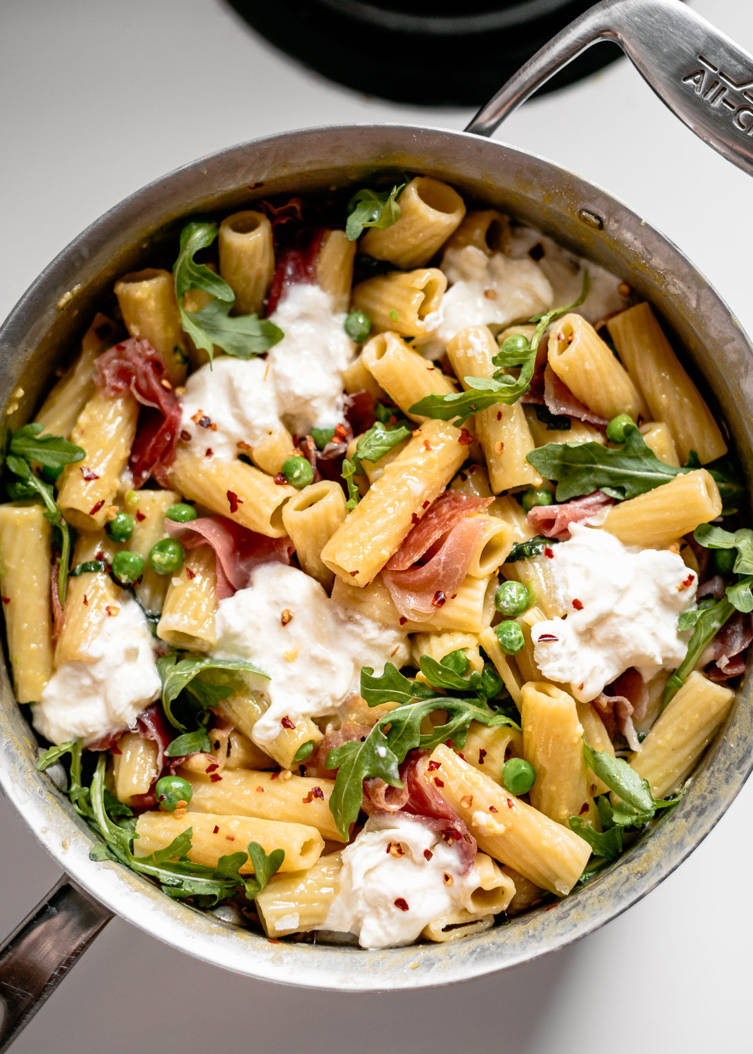 RIGATONI WITH PROSCIUTTO, PEAS & BURRATA